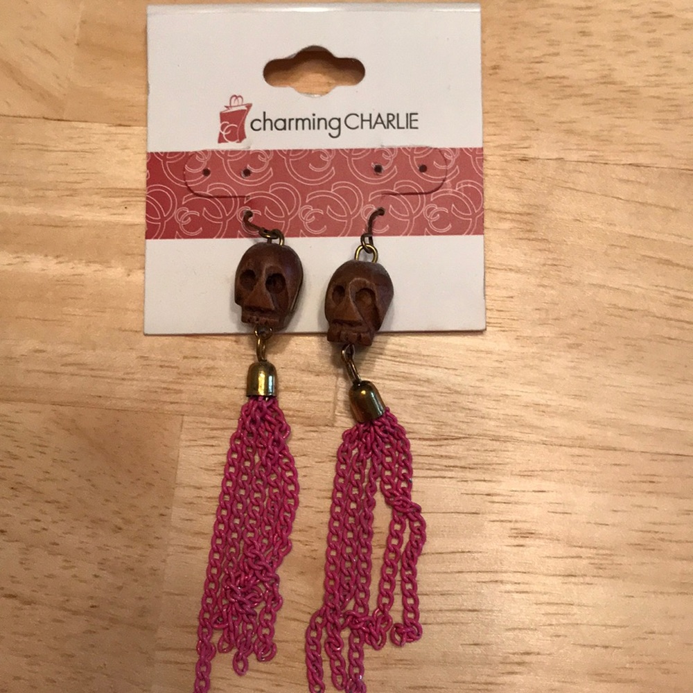 Charming Charlie wooden skull pink tassel earrings